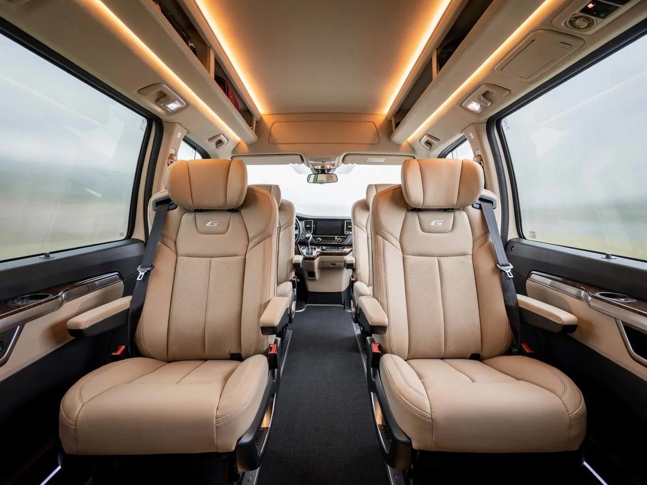 Interior of a luxury coach with comfortable seating.